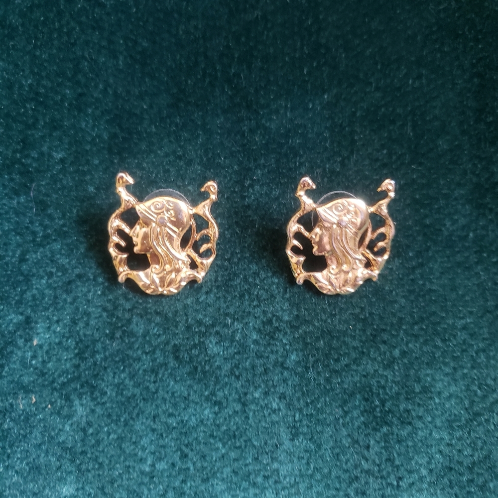 Gold tone stud earrings woman in bonnet